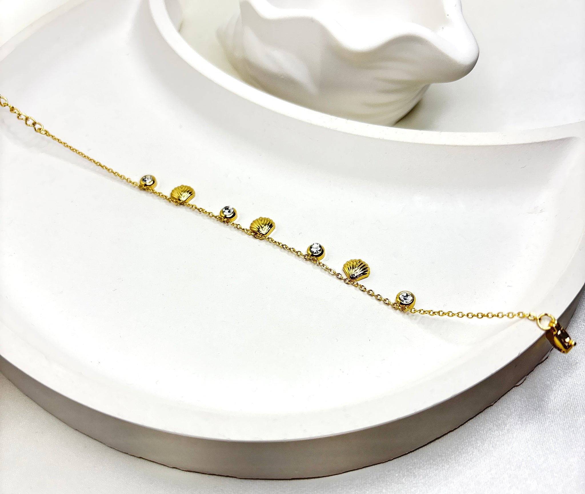 The Golden Seashell Charm