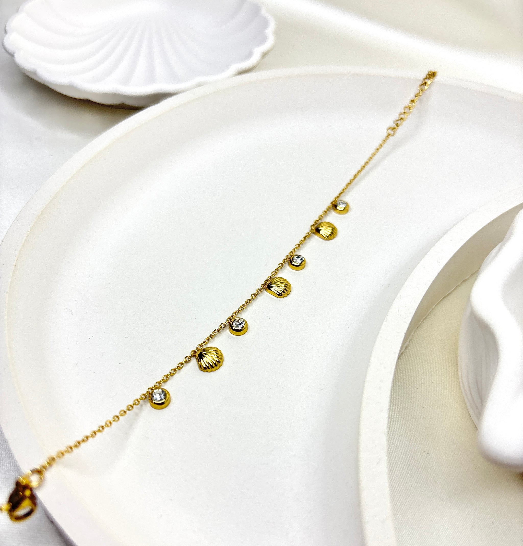 The Golden Seashell Charm