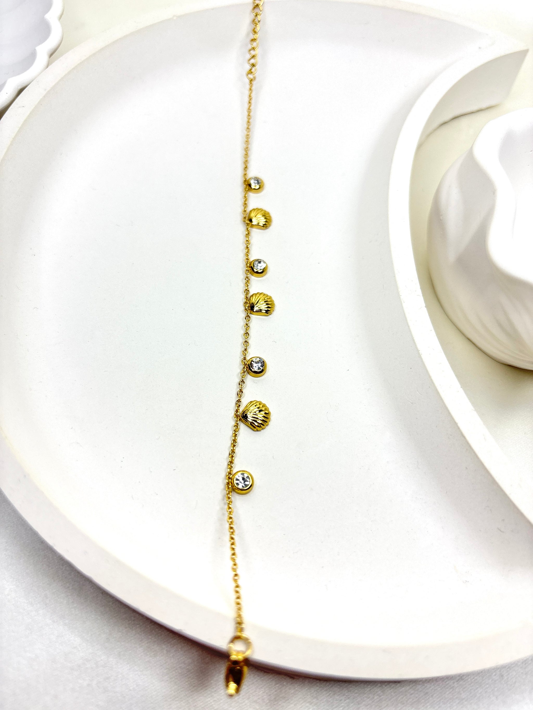 The Golden Seashell Charm