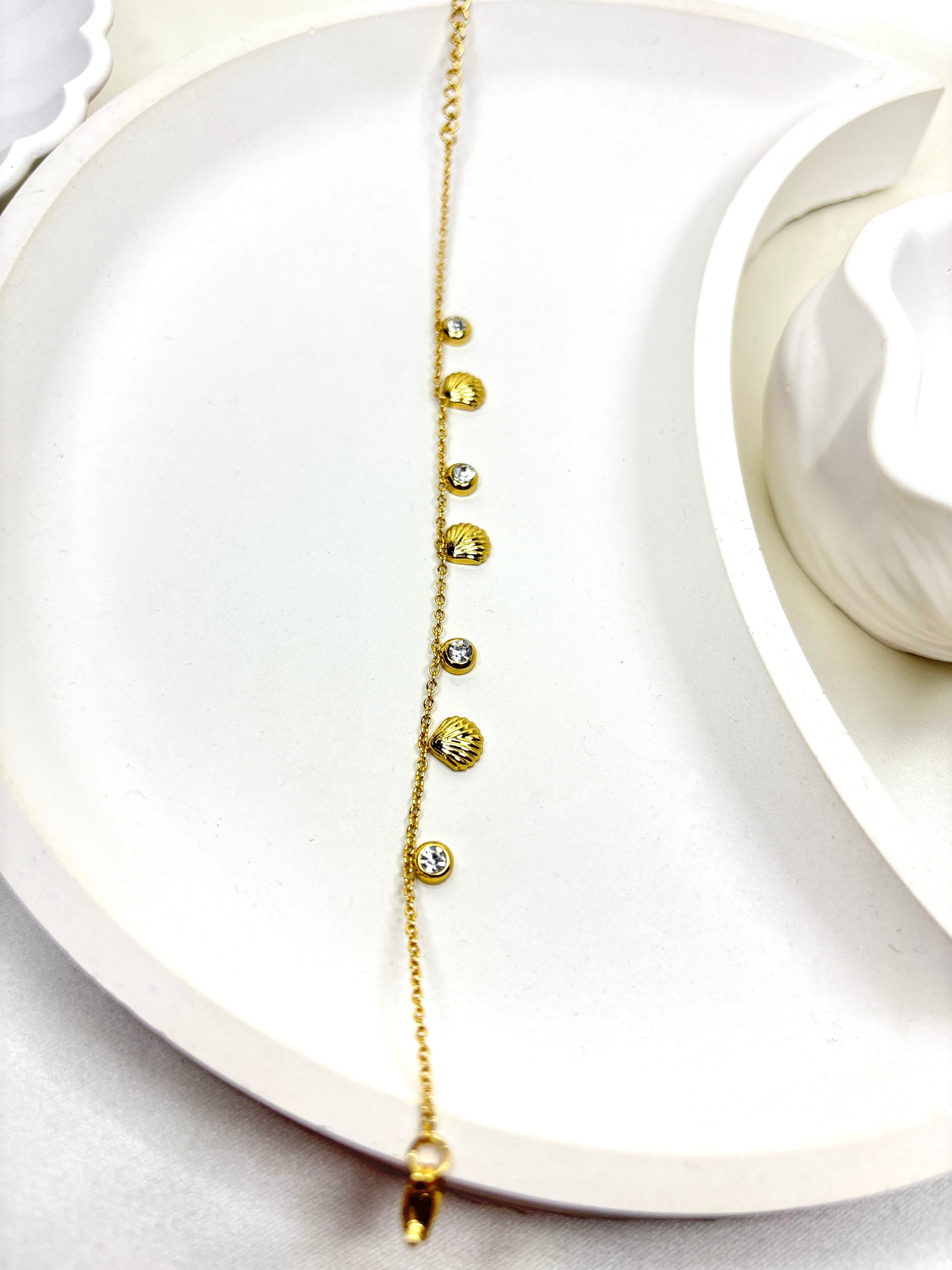 The Golden Seashell Charm